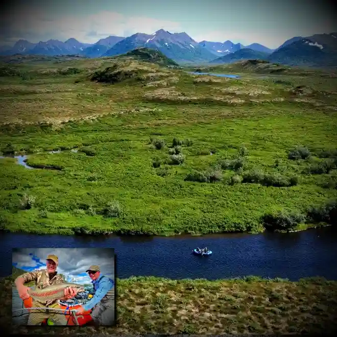 Kanektok River float fishing trip with angler and guide displaying trophy leopard rainbow trout in pristine Alaska wilderness